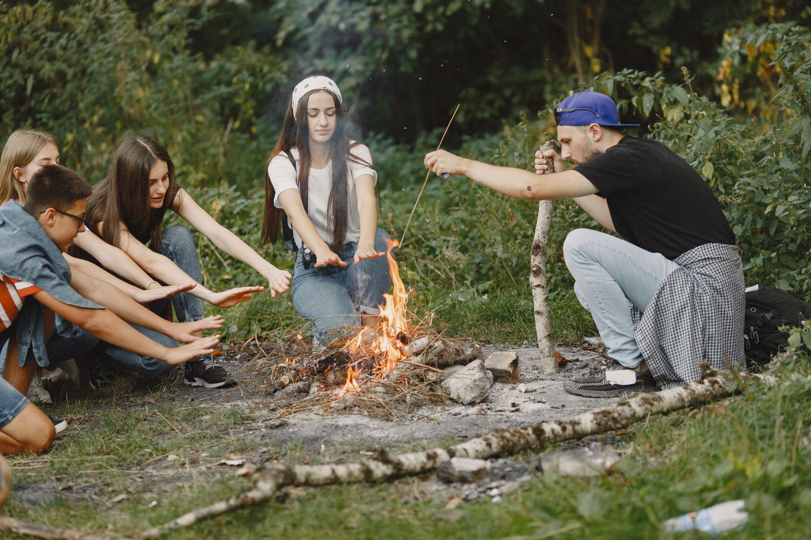 Teenagers around a campfire